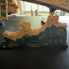 Three dioramas of Lego architecture, the great wall of China, Dubai and Tokyo