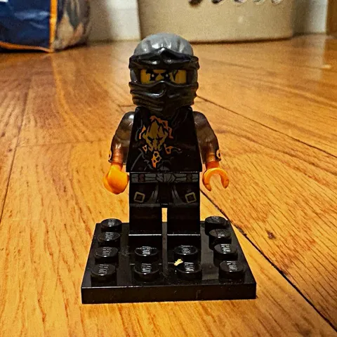 LEGO Black Minifigure w/ Helmet Mask & Flame Arms Print on Display Base