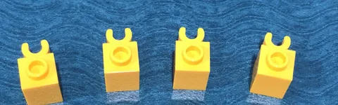 LEGO PART 60475b 1x1 MODIFIED BRICK WITH VERTICAL OPEN O-CLIP 4 PIECES (YELLOW)