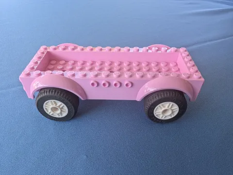 LEGO parts, pink vehicle base w/ rubber wheels, 8x16x2 1/3, #18937