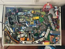 Lot of Lego buildings, vehicles, parts and pieces