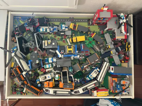 Lot of Lego buildings, vehicles, parts and pieces