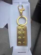 LEGO Insiders Limited Edition Gold Metal Brick Keychain in Box