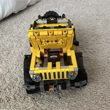Yellow Lego Jeep Rubicon, with steering and winch and opening hood
