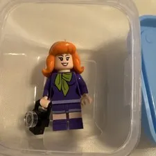 LEGO Female Minifigure Red Hair Purple Outfit with Camera Accessory