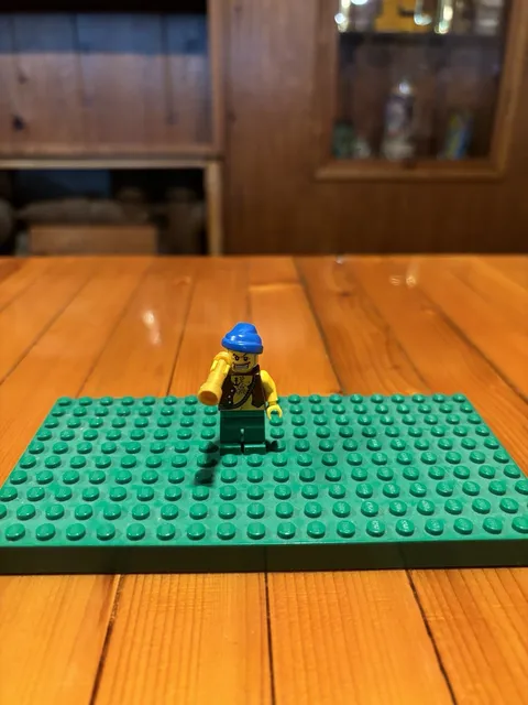 LEGO Pirate Green/White Stripes With Blue Hat And Seeing Eye Glass Figure