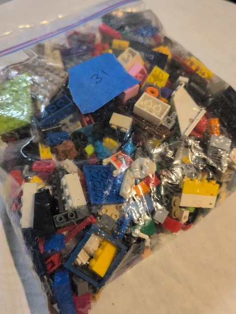 bulk bag of assorted LEGO parts and pieces.