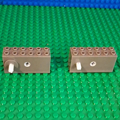 Lego Windup Motors. 2 Pieces. 1 Raised With Long Axel. 1 Standard. Work Great