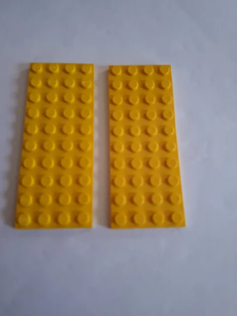 No 414.  2x Lego plate 4x10.  3030 Yellow