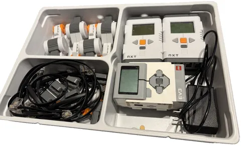 LEGO Mindstorms EV3 + NXT and motors + sensors and cords.