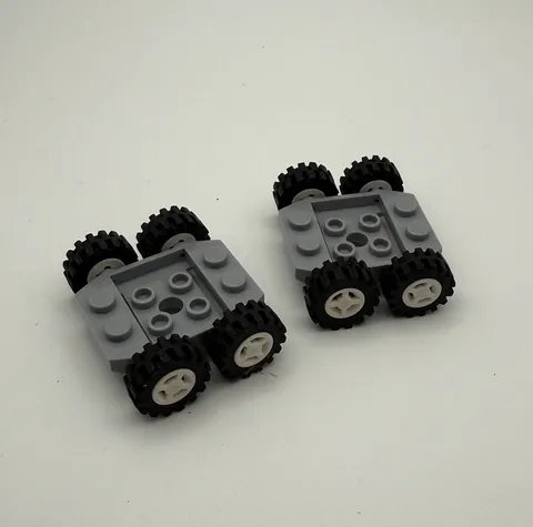 2 LEGO Light Bluish Gray Vehicle Base 3x4x2/3 Wheels Black & White Rims 24326