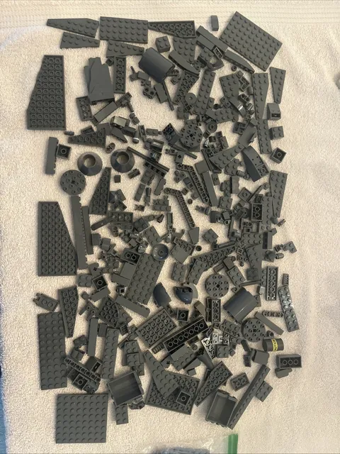 Lot of assorted  dark gray bricks & pieces.  14.7  ounces