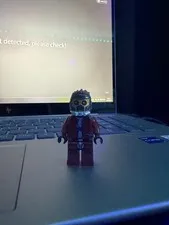 LEGO Minifigure Figure with Red Outfit, Spiky Hair, Goggles and Helmet