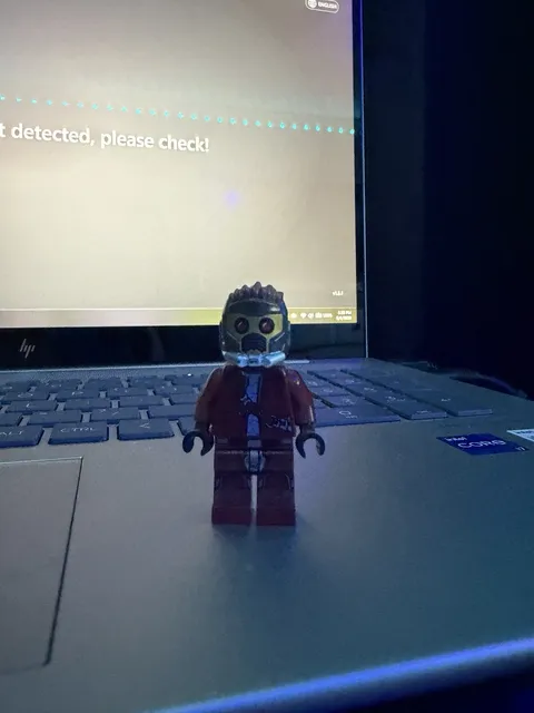 LEGO Minifigure Figure with Red Outfit, Spiky Hair, Goggles and Helmet