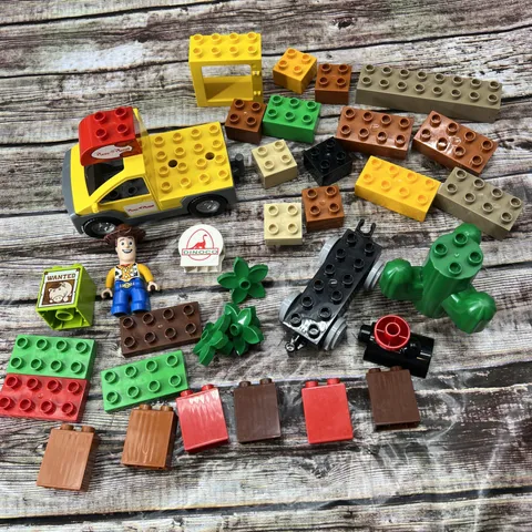 Lego Duplo Lot Of 35 Bricks Plus Disney Toy Story Pizza Planet, Cactus, Train