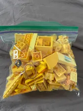 1/2 lb bag of random yellow lego pieces - used pieces - random pieces