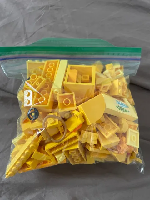 1/2 lb bag of random yellow lego pieces - used pieces - random pieces
