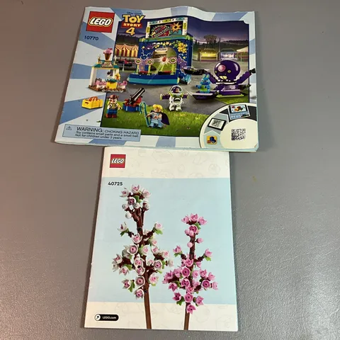 TWO LEGO ASSEMBLY MANUALS, TOY STORY AND FLOWERS, (J)