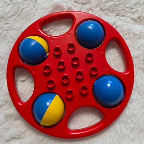 Vintage LEGO Duplo Circular Rattle Red with Blue Yellow Wheels