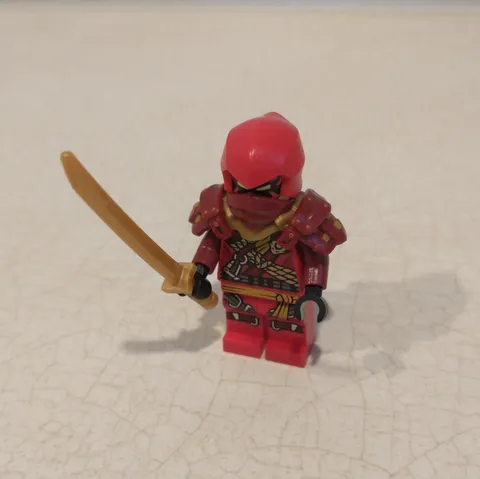 Kai minifigure Lego Ninjago with gold sword, mask, shoulder pads