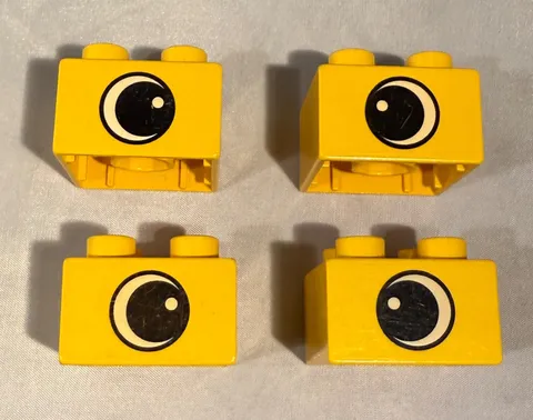Lot of 4 Bricks Lego Duplo Bricks 2x2 Yellow Crossed Eyes