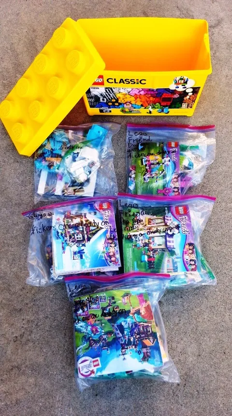 Legos in Yellow Lego storage brick box-5 sets 41100, 41119, 41124, 41300, 41323