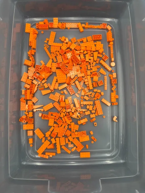 10 oz. Mixed Orange Legos - standard blocks and unique pieces (Lot A)