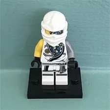 LEGO NINJAGO White Hooded Ninja Minifigure with Yellow Arms Black Display Stand