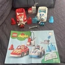 Two Lego Duplo Push & Go Race Cars From Set #10947  And Some Accessories ￼