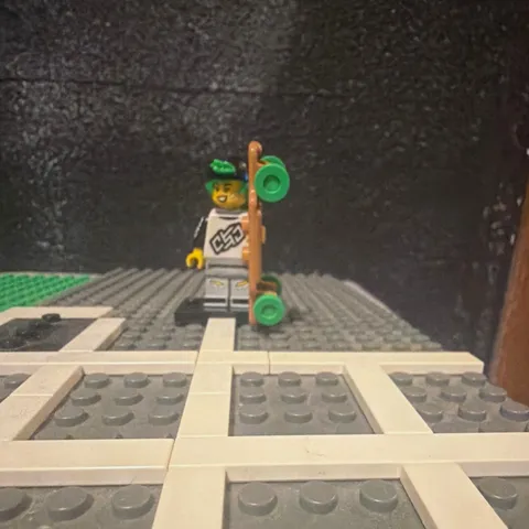 LEGO Skateboarder Minifigure w/ Brown Skateboard Green Wheels Black Helmet