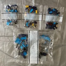 4 SEALED BAGS of Legos Black yellow Blue Gray