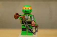 Michelangelo Minifigure LEGO TMNT 79104 tnt003 Licking Lips With Weapon