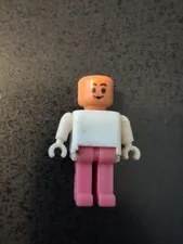 Vintage lego figurine mini figurine pink legs white top no hat or hair