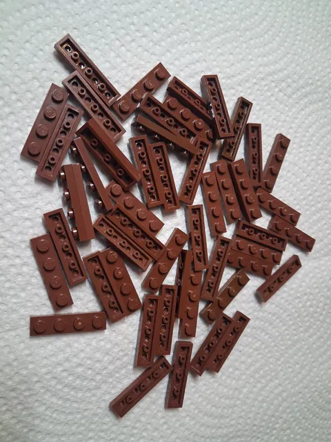 A Lego Lot 51 Reddish Brown Plate 1 x 4 3710 21338 10236 21361 75397