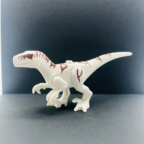 Lego White Dinosaur Atrociraptor with Reddish Brown Markings and Red Eyes