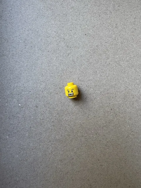 Lego Minifigure Head Determined Expression With Thin Eyebrows With grin Teeth