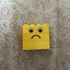 LEGO One Item Using 4 Yellow Brick. Happy On One Side, Sad On The Other