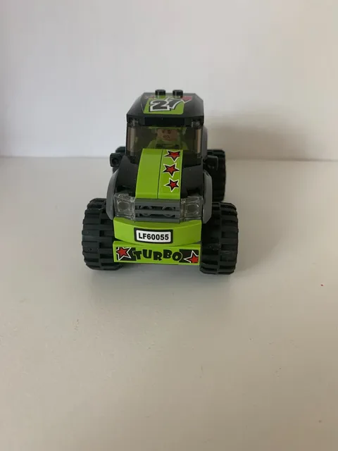 Lego monster truck with Lego man and direction booklet