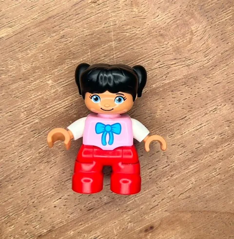 LEGO DUPLO Girl Figure with Black Hair Pigtails Pink Shirt & Red Pants