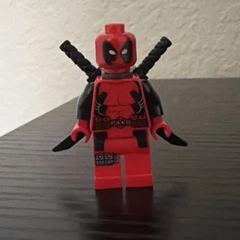 LEGO Deadpool X-Men Minifigure. Used, face is worn, torso crack left side.