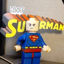 Slightly Larger 3D Printed LEGO Bald Guy In Superman Suit (Sign Included)