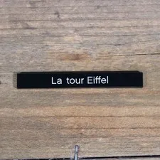 LEGO Black Tile 1 x 8 with 'La tour Eiffel' Pattern 4162pb107 from Set 21019