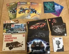 Lot of 12 LEGO instruction Manuals and 2 Pokémon Player’s Guides