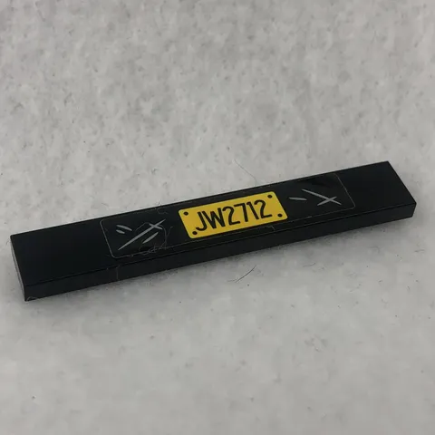 LEGO 6636pb217 Black Tile 1 x 6 with Yellow 'JW2712' Pattern (Sticker) (x1)