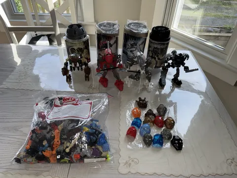 LEGO Bionicle Canister Lot Set of 4 Containers, 14 Masks, Extra Pieces Read Desc