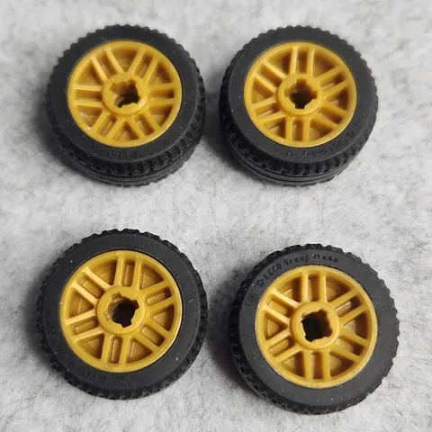 LEGO 11208c01 Wheel 14mm D x 9.9mm with Black Tire 21 x 9.9 Pearl Gold x4