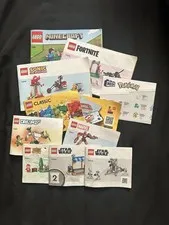 collection of instruction manuals for various building sets from LEGO