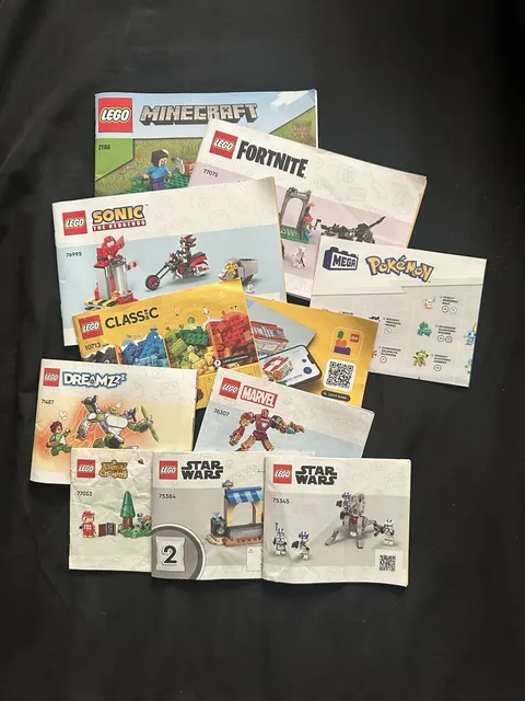 collection of instruction manuals for various building sets from LEGO