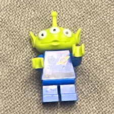 LEGO Toy Story Alien Minifigure Green 3-Eyed Head w/ Blue Outfit. Dirty edition