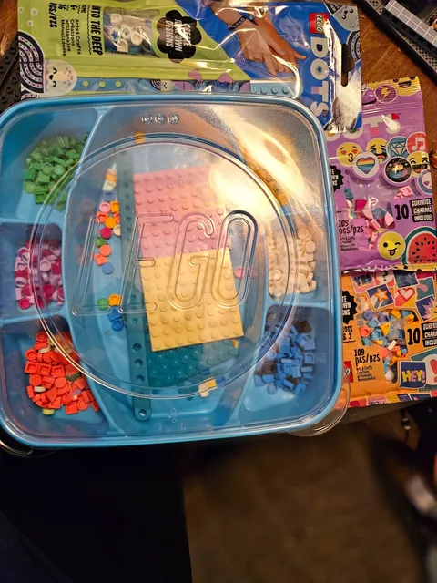 LEGO DOTS craft lot featuring a mix of loose pieces and three factory-sealed